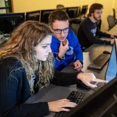 Students working on a project in a computer lab.